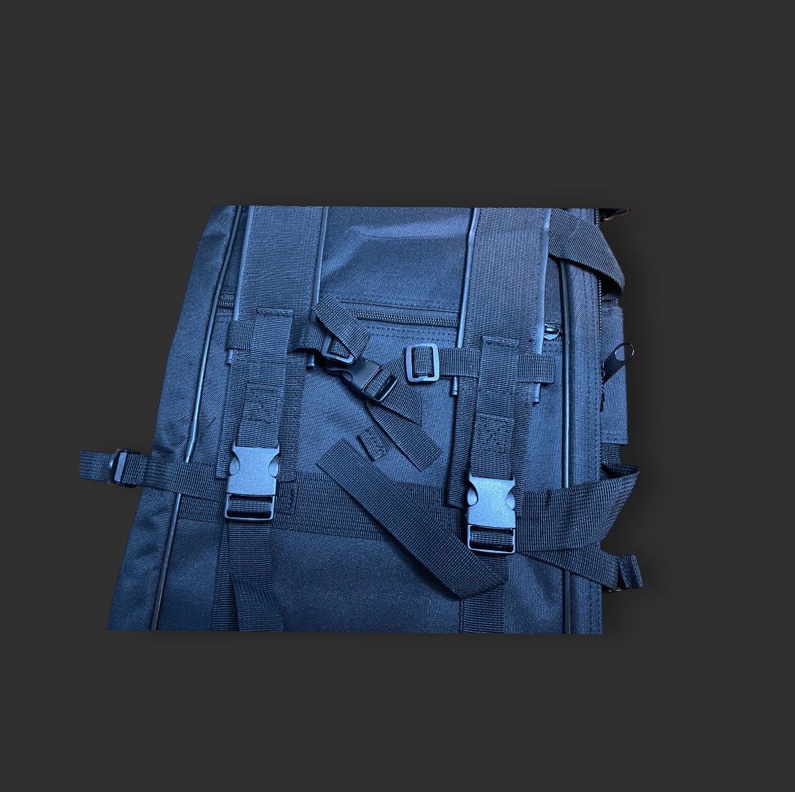 36'' dual gun backpack crafted from water-resistant 600D nylon with multiple straps and buckles on a dark background by BM.