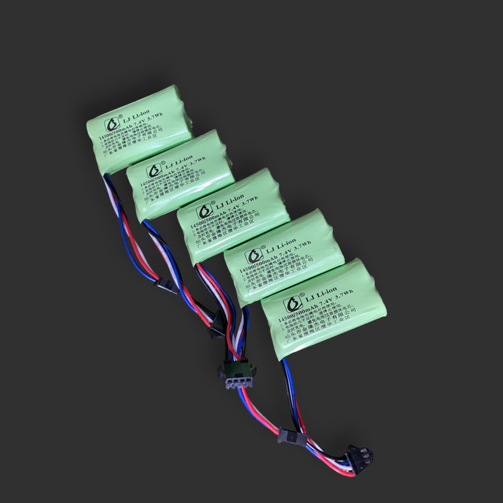 Five XQ Li-ion 7.4v 14500/500 mAh 2S batteries with attached multicolored wires are arranged in a row against a dark background.