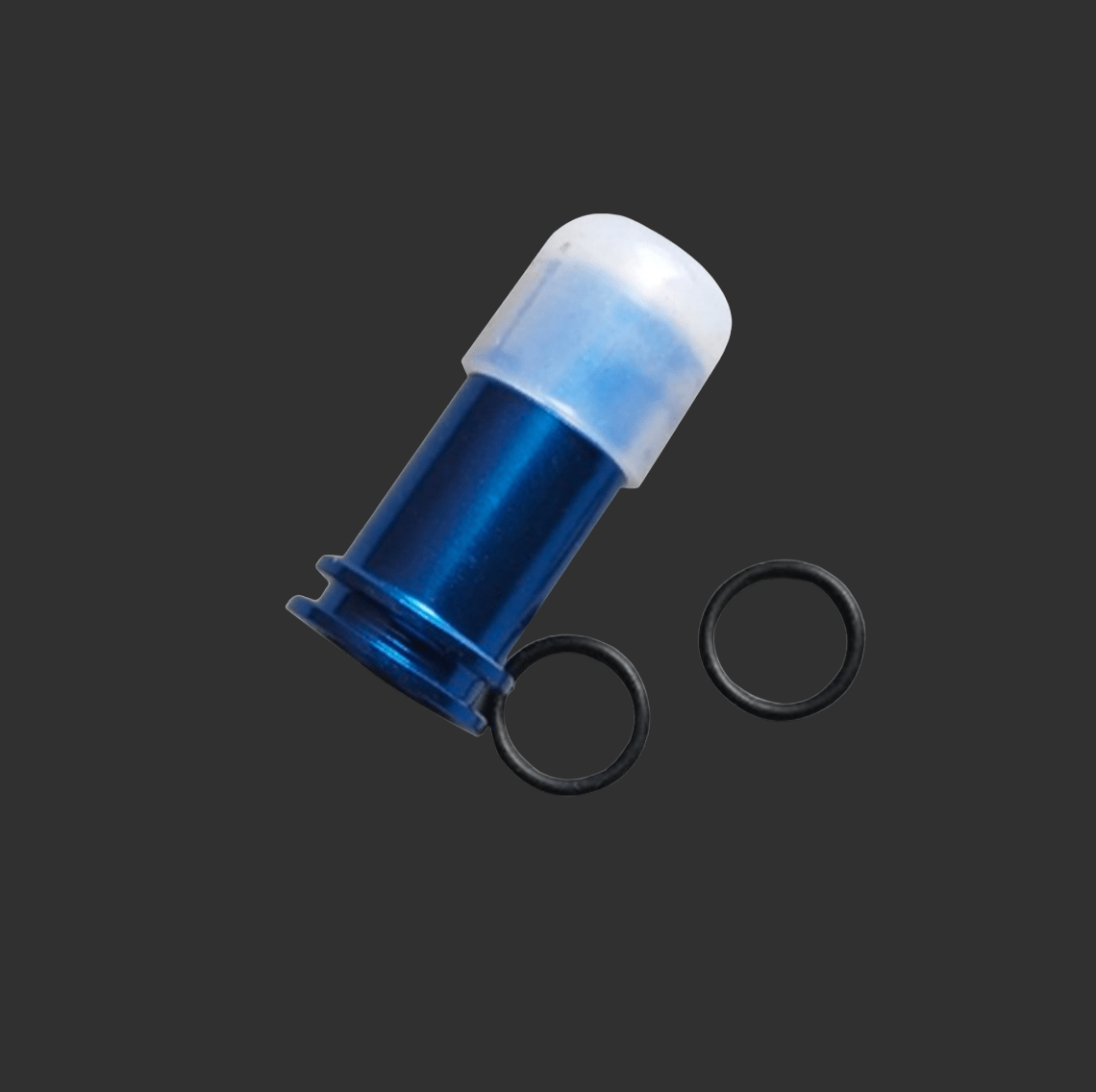 A blue cylindrical object with a white cap and two black O-rings, featuring an LTD Air Seal Nozzle for improved air compression, is set against a dark background.