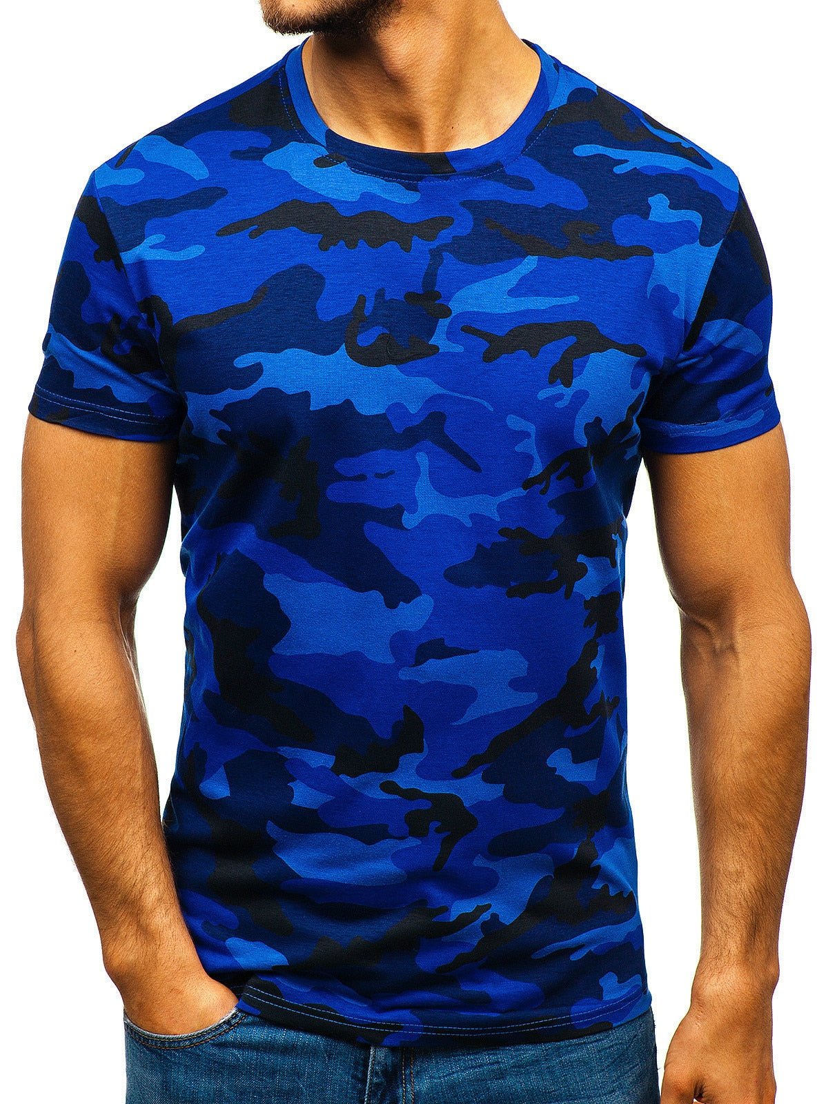 A person wearing a blue BlasterMaster Camo T-Shirt, embodying high street leisure with their hands in the pockets of their blue jeans. The photo focuses on the upper torso and upper arms.