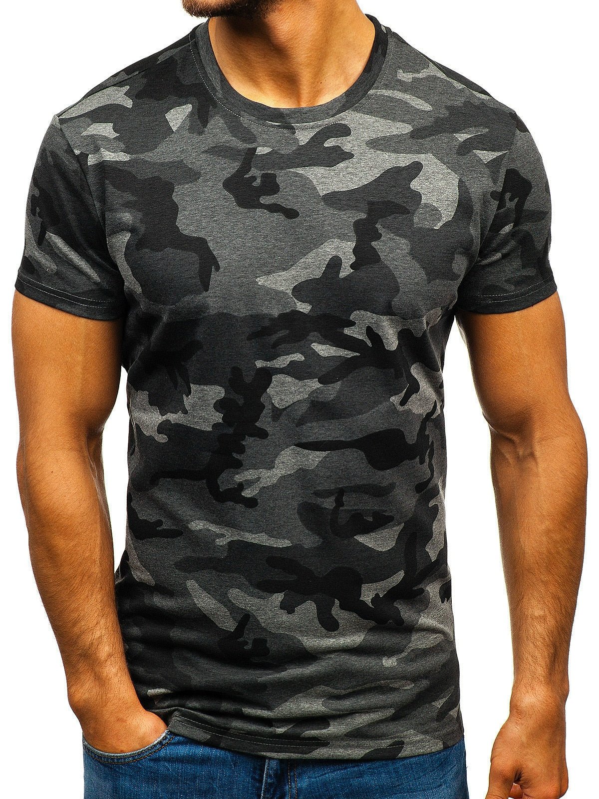 A person wearing a fitted dark grey and black BlasterMaster Camo T-Shirt, perfect for high street leisure, and blue jeans stands with hands in pockets.