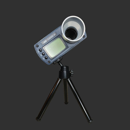 A small electronic device with a screen and buttons, mounted on a mini tripod, designed for precision tuning of your BlasterMaster E9800X Tachymeter, set against a black background.