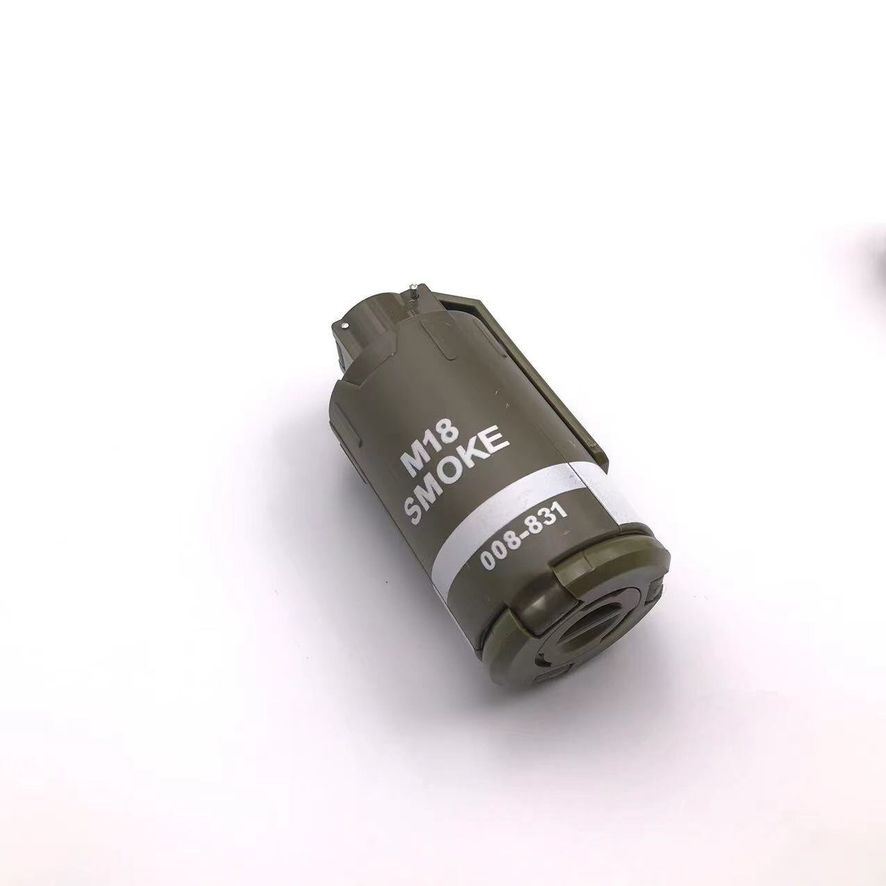 A compact military-grade G4 smoke grenade by BlasterMaster with a matte green finish and white labeling indicating "G4 SMOKE" and a serial number "008-831." Unleash chaos on the battlefield with its dense smoke cover, ensuring victory in high-stakes scenarios.