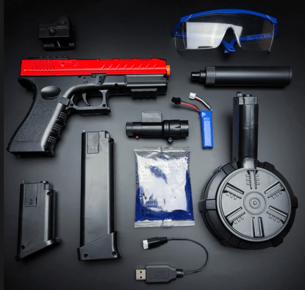 The GLE 817s Chrome Red Blaster airsoft pistol, featuring a striking red and black color scheme, comes with various accessories including safety goggles, magazines, a silencer, USB charger, battery, BBs, and a laser sight. All items are neatly arranged on a sleek black surface.