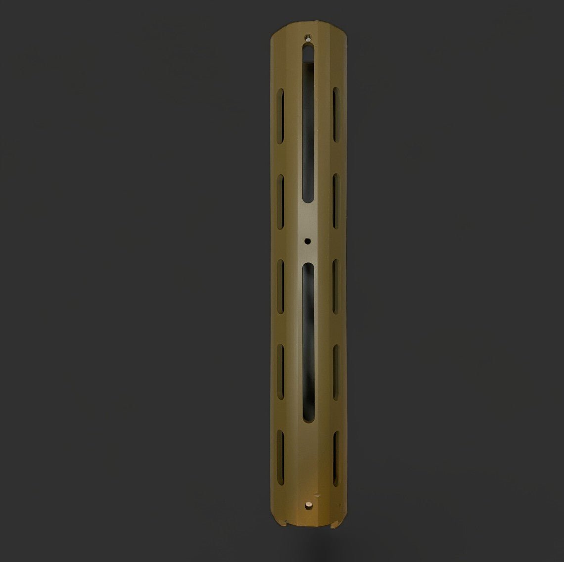 A cylindrical metal object with vertical slits and a single horizontal groove, colored in a matte gold finish, resembling the Honey badger Handguard by BlasterMasters Upgrades, on a dark background.