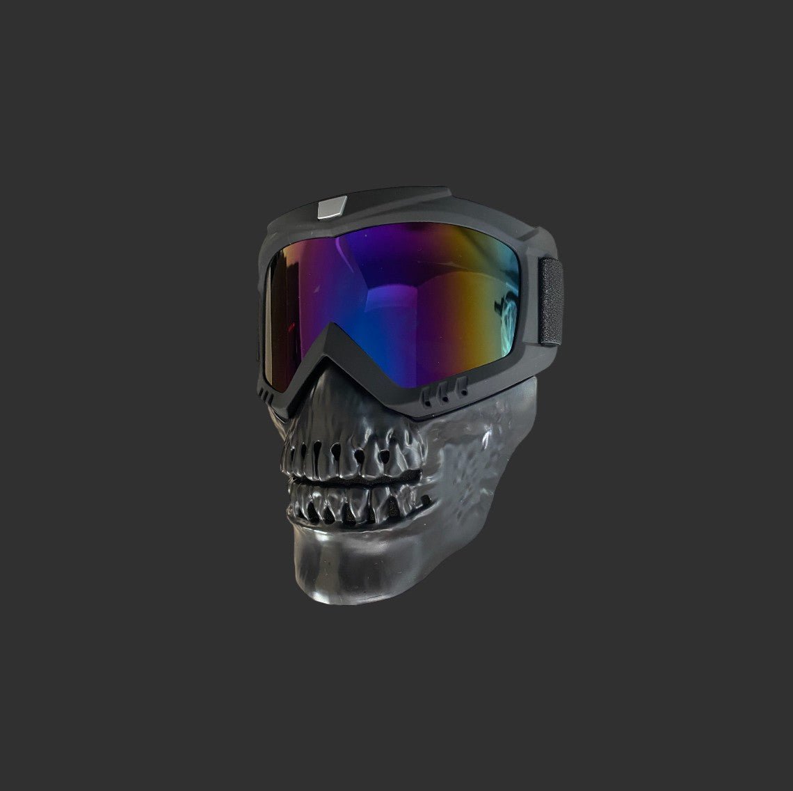 A pair of reflective goggles attached to a lightweight construction plastic mask designed like a skull, shown on a dark gray background. The BlasterMasters Kids Gelsoft Mask.