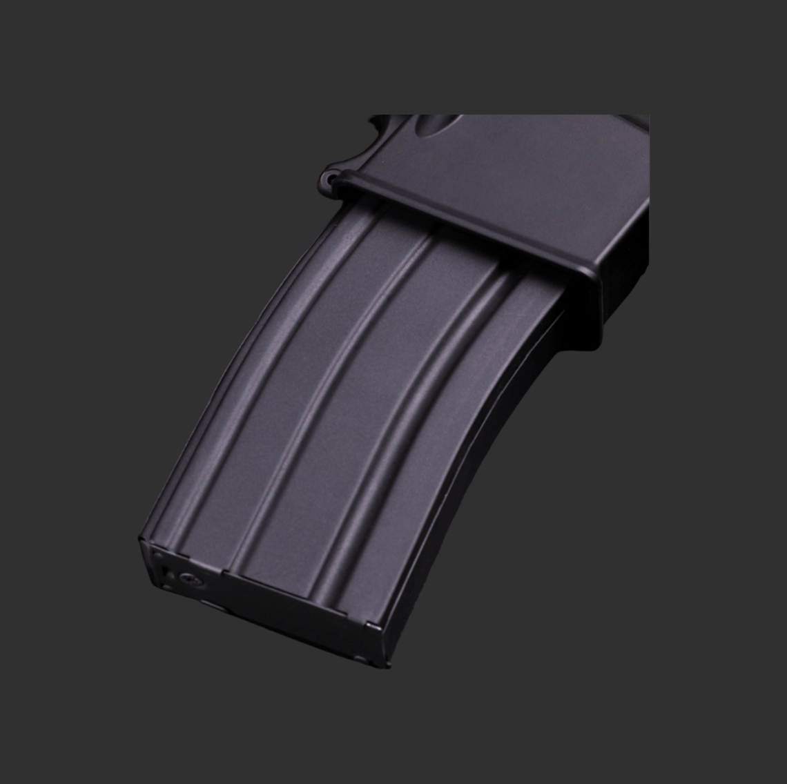 Close-up of a black, Kublai M4-Style Gel Blaster magazine against a dark background, showcasing its authentic M4 design and tactical engineering.