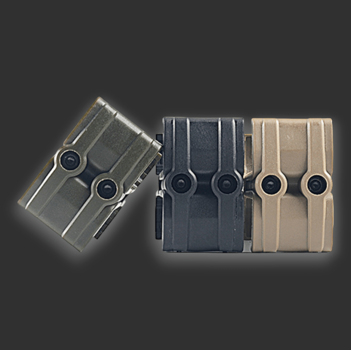 Three Dual magazine clips from BlasterMasters of different sizes and colors (green, black, and tan) are arranged diagonally against a dark background. Each clip has a rugged design with visible screws on the front, showcasing their compatibility with Gel Blasting Accessories.