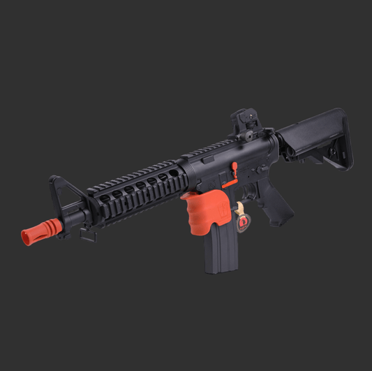 The KUBLAI MK18 V2 Gel Blaster by BlasterMasters, featuring a black finish with robust metal components, an orange tip, orange trigger, and orange magazine grip, along with a secured safety lock, ensures tactical precision.