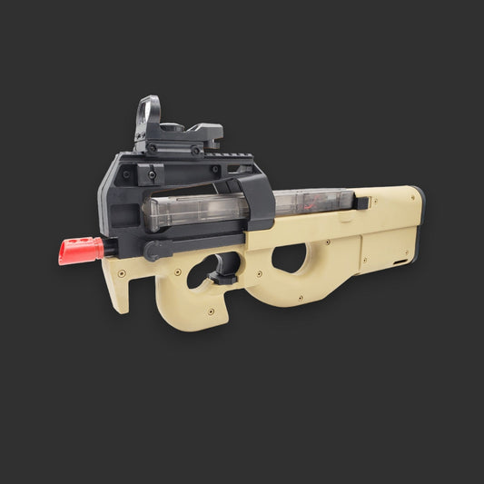 A beige and black TGXS P90 mosfet version with a red tip, designed to resemble a real firearm, featuring advanced components for enhanced tactical gameplay, set against a gray background.