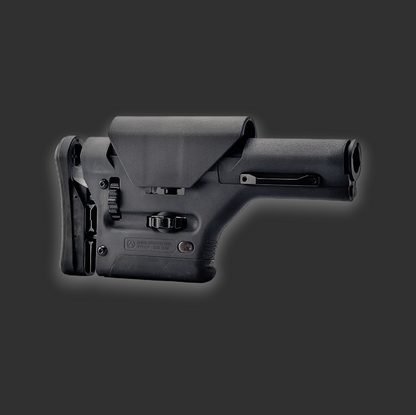 A black adjustable Magpul PRS Metal Buttstock for AR15 with cheek rest, buttons, and levers on a dark gray background showcases the excellence of precision engineering by BlasterMasters.