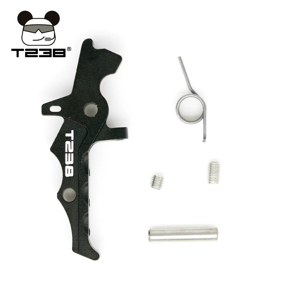 A black BlasterMasters T238 Trigger with three additional parts: a spring, two screws, and a metal rod, arranged on a white background. The BlasterMasters T238 Trigger logo featuring a stylized bear head with sunglasses is in the top left corner.