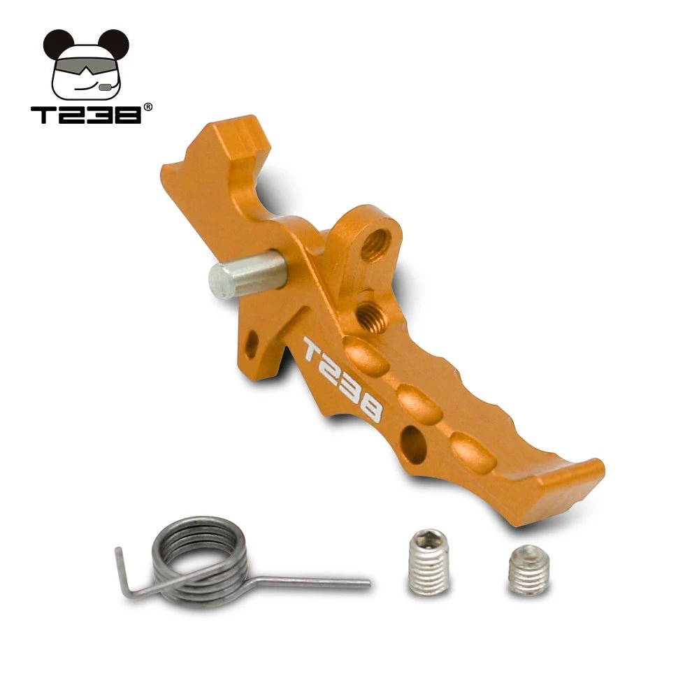 Orange metal T238 Trigger and components, including a spring and two small screws, crafted from CNC aluminum alloy with the BlasterMasters logo in the top left corner.