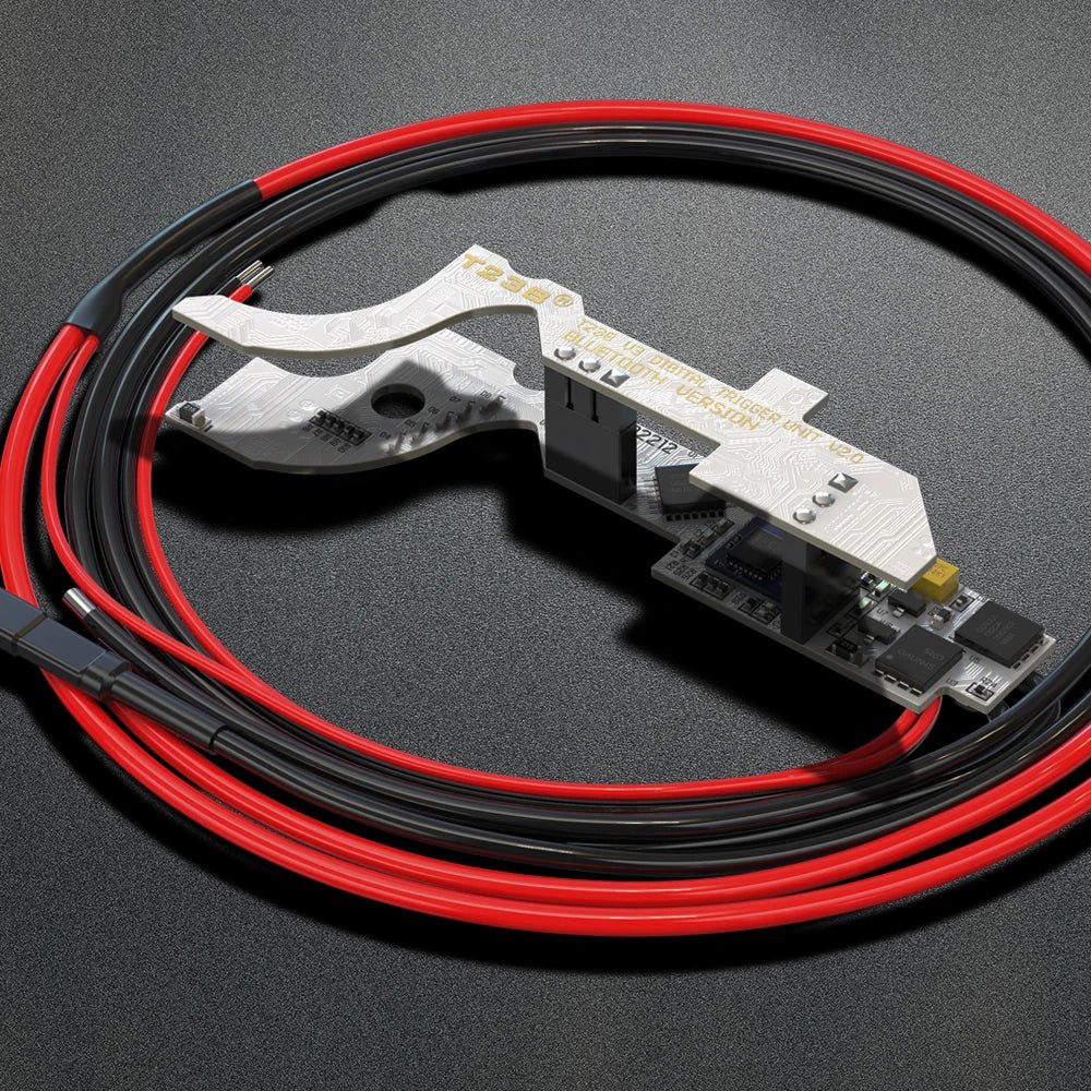 A BlasterMasters T238 V2.0 Bluetooth Mosfet Optical Sensor APP Control Programmable for Airsoft V3 Gearbox and a coil of red and black cables with connectors are displayed on a dark surface.