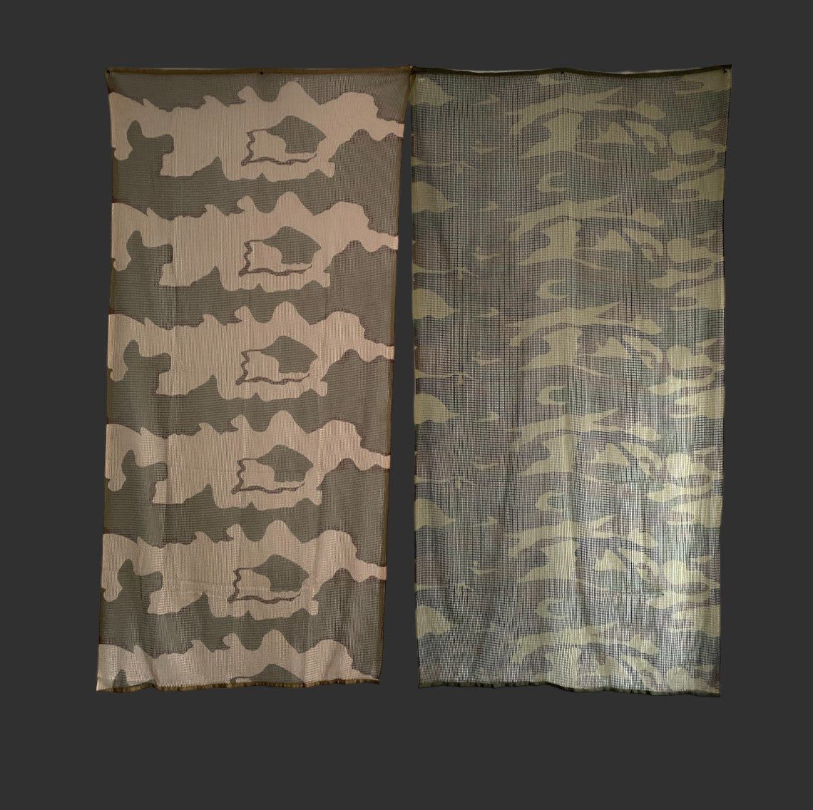 Two camouflage netting panels with different patterns are displayed against a dark background. The panel on the left has a more defined pattern, while the one on the right has a blurrier design. Perfect as a versatile tool for gel blaster enthusiasts or even as a BlasterMasters Tactical Scarf for stealth missions.